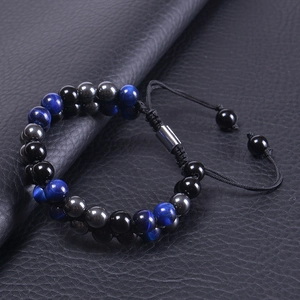 Close-up of double-layer beaded bracelet with blue tiger eye and adjustable woven cord