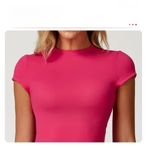 Close-up of rose red short sleeve yoga top with classic crew neck and elastic fabric