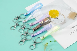 Assorted holographic PVC lanyards with silver metal clasps in vibrant pastel colors