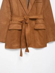 Detailed macro view of the brown faux suede jacket waist belt and fabric texture