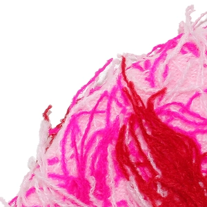 Close-up of soft fluffy balaclava knit fabric with pink and red textured faux fur fibers