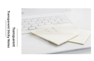 Close-up of clear sticky notes on laptop keyboard showing transparent waterproof material