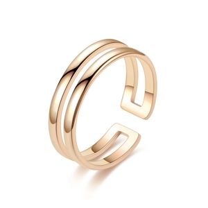 Detail of a gold double-layer open stainless steel ring with a minimalist smooth surface