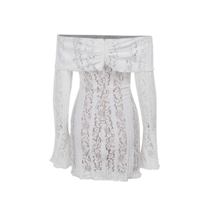 Detailed view of white floral lace texture on an off-shoulder bodycon dress