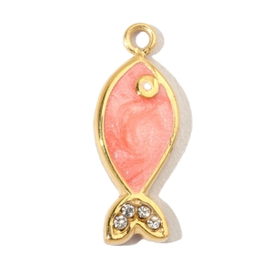 Close-up of a fish pendant with pink enamel glitter and small rhinestones on the tail