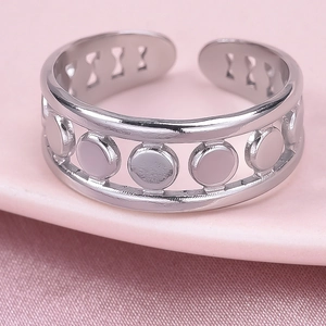 Detailed close-up of a silver 304 stainless steel ring with hollow geometric patterns