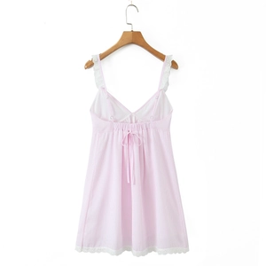 Pink striped slip dress with white lace trim and back drawstring on wooden hanger
