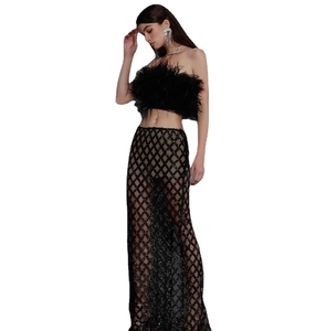 Elegant black two-piece evening set featuring ostrich feather top and sequin maxi skirt