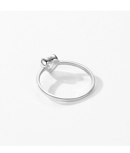 Macro close-up of a silver S925 heart-shaped ring with sparkling cubic zirconia stone