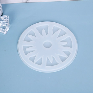 Detailed top view of a sun-patterned translucent silicone mold for DIY resin coasters