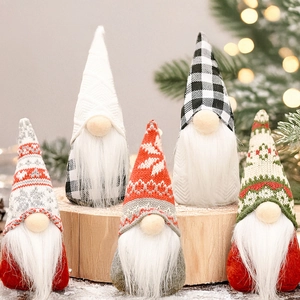 Detail of five mini Christmas gnomes with knitted hats on a rustic wood tray