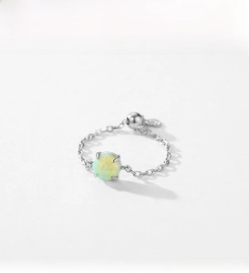 Macro view of adjustable S925 sterling silver chain ring with round opal stone