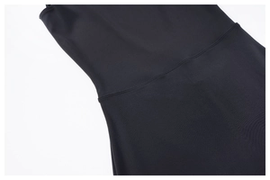 Close-up of premium stitching and texture on black flared yoga jumpsuit fabric