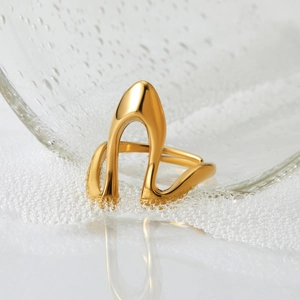 Irregular geometric open ring in 316 stainless steel with gold plated finish on glass