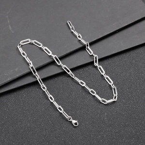 Macro shot of silver stainless steel paperclip chain with a secure spring clasp closure