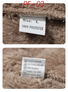 Detail view of the brown fleece hoodie label showing size L and 100% polyester fabric material