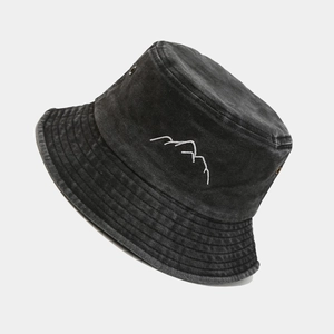 Washed dark gray fisherman hat with minimalist mountain embroidery in a side profile view