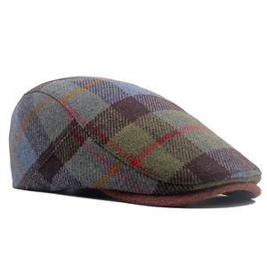 Close-up of wool blend checkered flat cap with vintage British plaid pattern detail