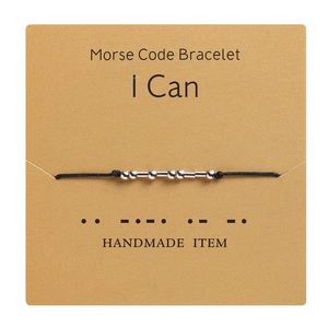 Detail of Morse Code bracelet with silver beads on an I Can motivational card