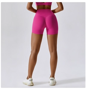 Detail view of high-waist yoga shorts with V-shaped stitching for bum lifting effect