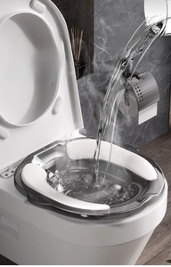 Detail of gray sitz bath basin for toilet showing steam effect and heat resistance