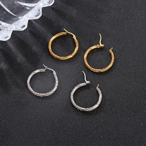 Twisted round stainless steel hoop earrings in gold and silver finish for women