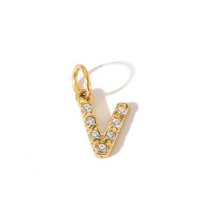 Macro detail of gold PVD stainless steel letter V pendant with inlaid cubic zirconia