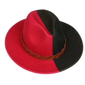 Detail of red and black bicolor wool felt fedora featuring a brown braided band