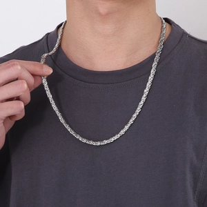 Men's silver titanium steel braided rope chain necklace worn by male model on white background