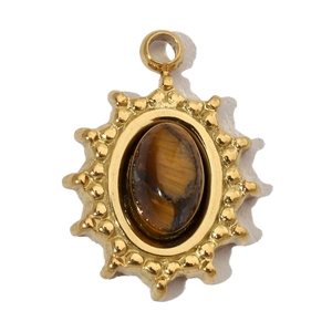 Detail of a golden oval sunburst pendant featuring a natural brown tiger eye stone