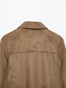 Detailed view of the brown faux suede jacket collar and stitching on the back shoulder