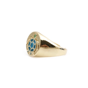 Golden sea turtle signet ring with colorful blue and green enamel inlay on white background