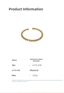 Macro detail of golden geometric open cuff bracelet with textured alloy surface