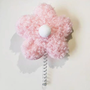 Pink teddy fleece flower accessory with white core and metal spring base for car decor