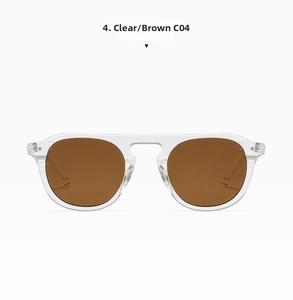 Detailed front view of clear frame sunglasses with brown lenses and rivet details