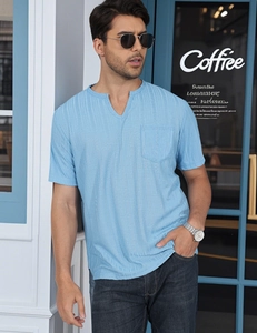 Detail of light blue short sleeve V-neck shirt with pocket and slub texture