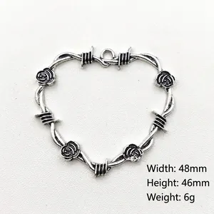 Antique silver heart pendant with thorns and rose design, dimensions 48mm by 46mm