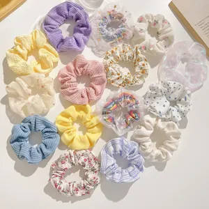 15-piece assorted hair scrunchie set in floral, mesh, and satin fabrics for women