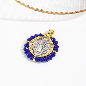 Two-tone St. Benedict medal pendant with blue faceted beads and detailed engraving