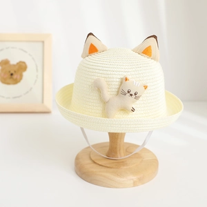 Close-up of kids straw hat with 3D cat ears and cartoon kitten embroidery detail