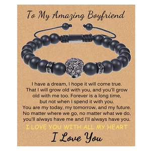 Close-up of beaded lion head bracelet on kraft paper gift card for boyfriend