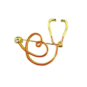 Broche stéthoscope cœur doré avec émail rouge et accents de strass blanc