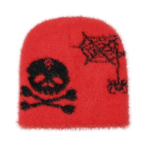 Detail of red faux mink fur beanie with black skull and spider web knit patterns