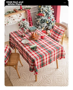 Detail of red and white plaid Christmas tablecloth and matching chair cushion covers