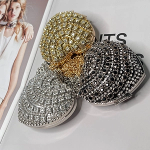 Detailed top view of luxurious heart-shaped rhinestone evening bags with metal chains