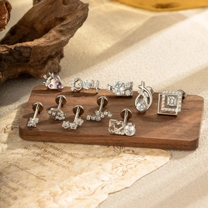 Exquisite 11-piece set of G23 titanium geometric flower stud earrings with pink zircon stones