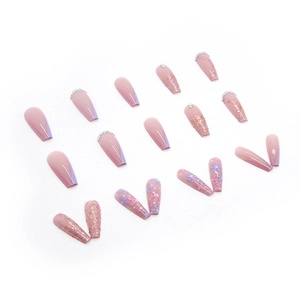 Long coffin press-on nails with pink glitter, floral patterns, and rhinestone accents