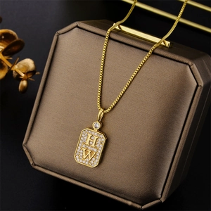 Luxury gold titanium necklace with HW letter pendant micro-set with pavé diamonds