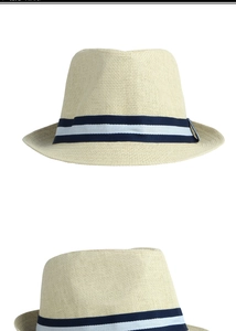Detailed views of a beige straw fedora hat with a blue and white striped ribbon