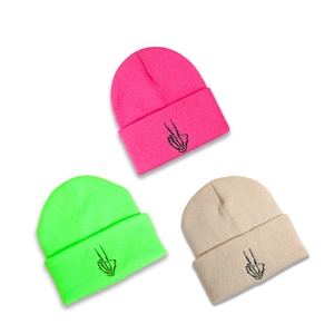 Stylish knitted beanie with skull hand embroidery in pink green and beige colors